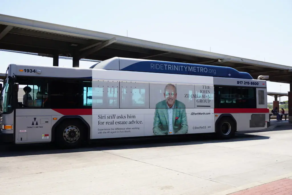 Trinity Metro bus with an advertisement on it for the John Zimmerman Group