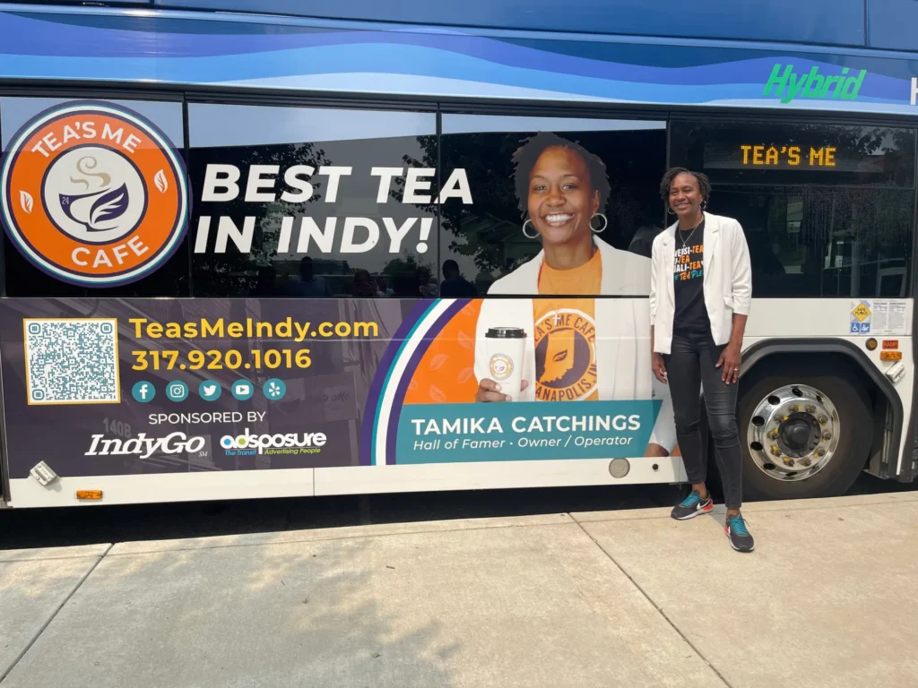 Tea's Me Cafe's Owner/Operator Tamika Catchings smiling with her new moving billboard!