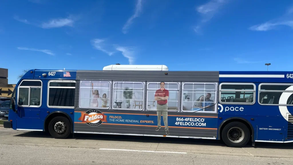A super kong advertisement on the side of a Pace Suburban Bus promoting Feldco, the leading home renewal experts in Chicagoland.